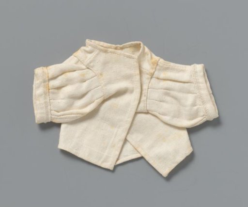 Bodice of Twilled Linen with Two Short Sleeves with Stitched Pleats at Top and Bottom. Front Ending in a Point. Trimmed with Decorative Band