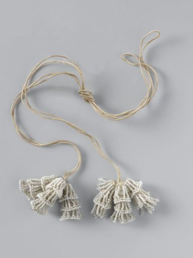 Aker or tassel of white glass beads, strung on threads