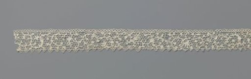 Strip of needle lace with C-shaped motifs for a dollhouse cabinet