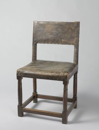 Chair with column legs, upholstered in cowhide
