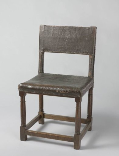 Chair with column legs, upholstered in cowhide