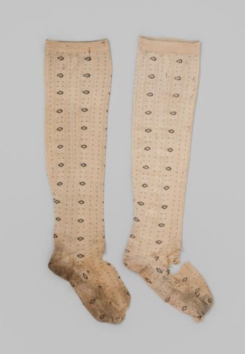 Stocking of Light Yellow Silk with Knitted Vertical Stripes, Alternating with Oval Motifs