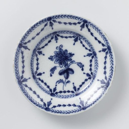 Plate of faience with flower and garlands