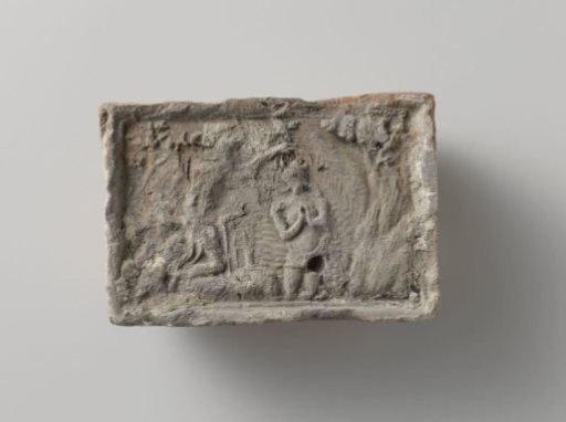 Fireplace surround with a representation of the baptism of Christ in the Jordan