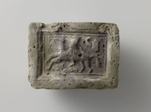 Fired fireplace tile, with a grotesque horse and rider in a square frame, and with a coat of arms and St. Andrew's Cross