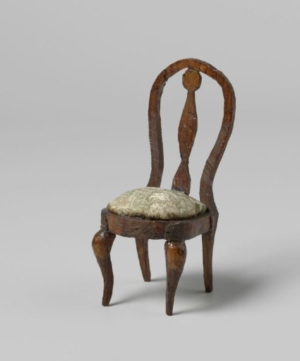 Chair with round, open backrests with central stile, the seat with floral and leaf motifs