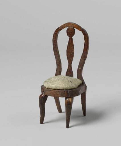 Chair with round, open backrests with central stile, the seat with floral and leaf motifs