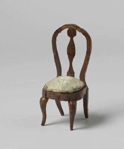 Chair with round, open backrests with central stile, the seat with floral and leaf motifs