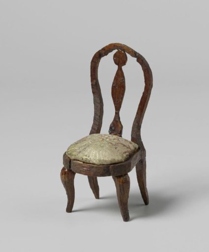 Chair with round, open backrests with central stile, the seat with flower and leaf motifs