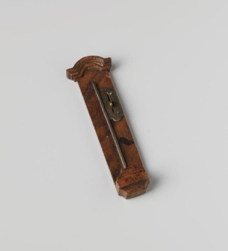 Barometer in a long case with a curved hood