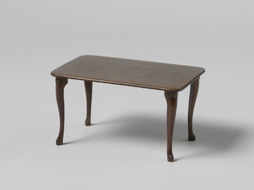 Table with a rectangular top on four S-shaped legs