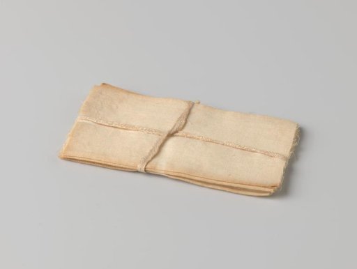 Stack of cloths, bound with a band