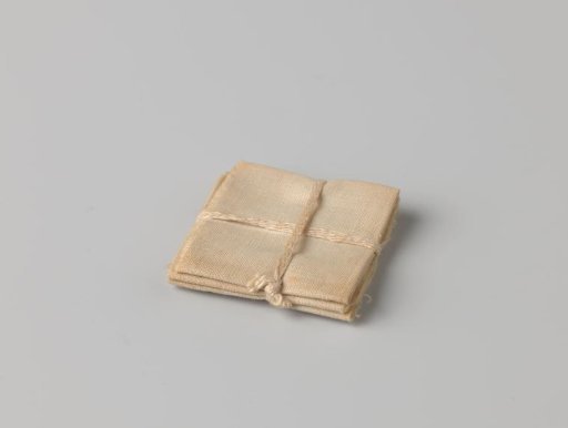 Stack of cloths, bound with a band