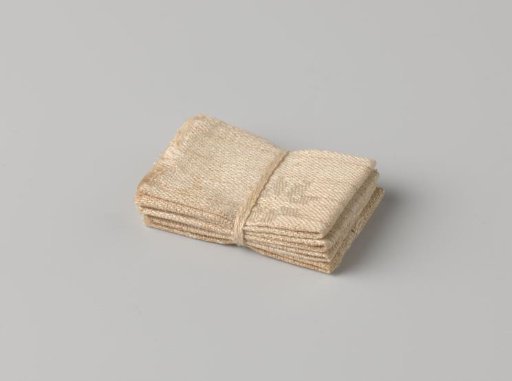 Stack of four canvases, bound with a band