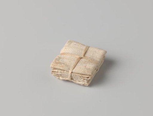 Stack of four canvases, bound with a band