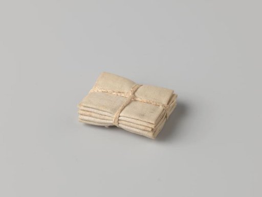 Stack of five cloths, bound with a band