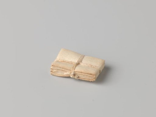 Stack of four cloths, bound with a band