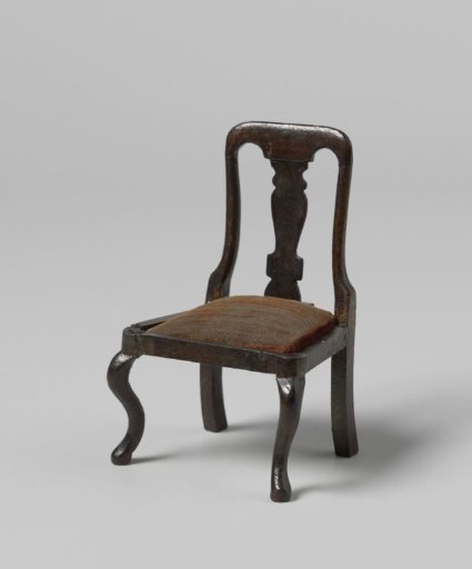 Chair, the back with a vase-shaped central panel, the seat with burgundy velvet