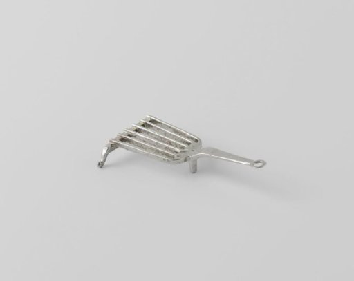 Trivet on three legs, with a handle ending in a ring
