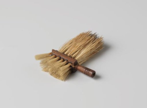 Brush with bristles on two sides