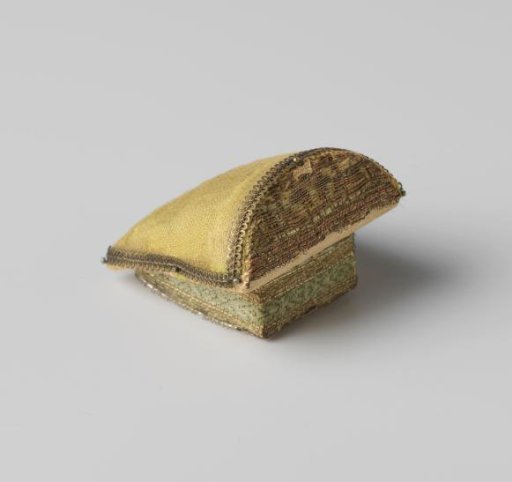 Bobbin lace cushion, covered with silk and trimmed with metal thread