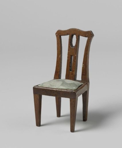 Chair with blue upholstery and straight back with openwork central stile