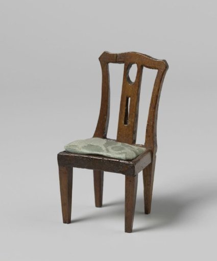 Chair with blue upholstery and straight back with openwork central stile