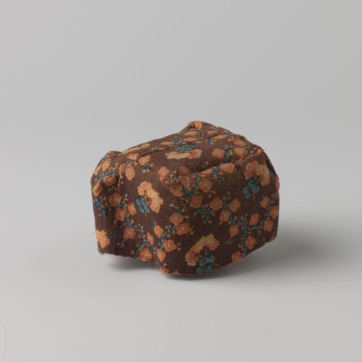 Fire basket cloth, printed with floral motifs in red, yellow and green on brown ground