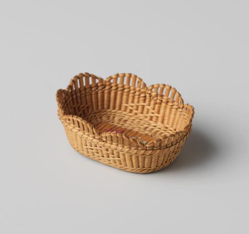 Basket, oval, with woven diamond pattern and embroidered flowers in red and green