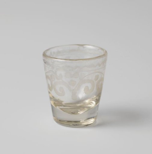 Cup decorated with engraved zigzag border above volutes and spheres