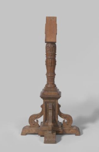 A carved lectern on a carved foot