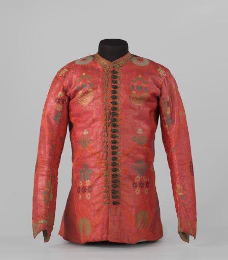 Short, straight jacket of rose-pink silk damask with floral motifs in brown and various shades of green, with long sleeves