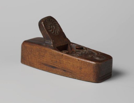 A wooden plane from 1764, with some carving.
