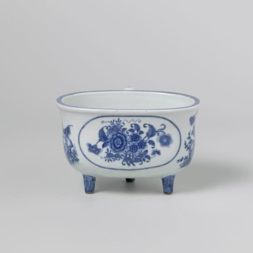 Oval firepot on three legs with medallion, flowers and a rooster