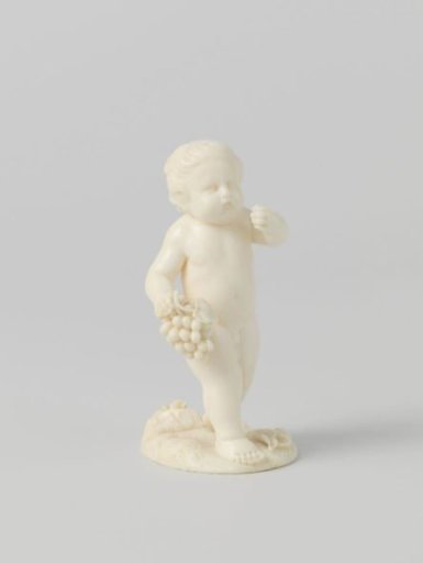 Boy with a bunch of grapes