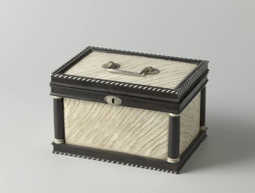 Stone chest decorated with borders, stripes and columns of ebony