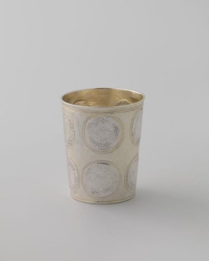 Silver cup in which eleven coins are soldered