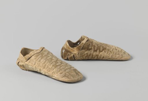 Shoe, flat, with front flap and heel faded to light yellow, made of velvet and fitted with a stamped geometric decoration on a cowhide sole, with a strap fastening on the instep