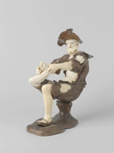 Seated begging figure