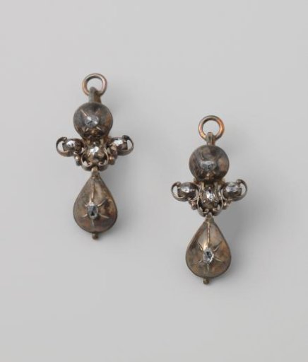 Pair of silver earrings set with diamonds