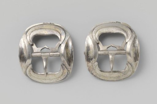Silver brooch with undulating relief decoration