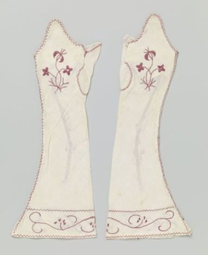 Mitten of white linen embroidered with a floral motif of red wool
