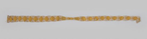 Garter - part of a pair - of silk, crocheted in white with yellow squares