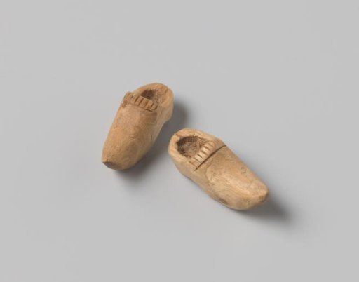 Five wooden clogs in a small box, children's toys