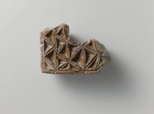 Architectural fragment, decorated with recessed triangles