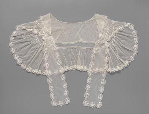Canezou with a double collar of lace embroidery, ending in two ribbon bows