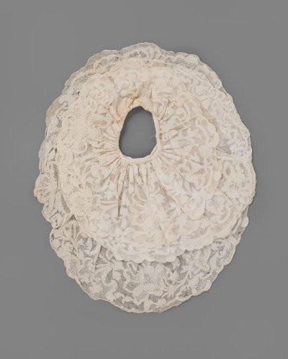 Embroidered fabric with a continuous pattern of corded appliqué work