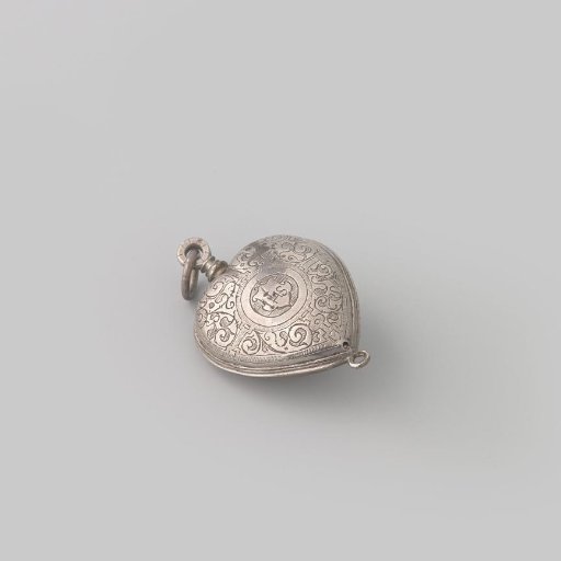 Bridal heart with chased child's head. On the reverse a coat of arms with IHS.