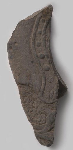 Fragment of a tombstone with sculpture