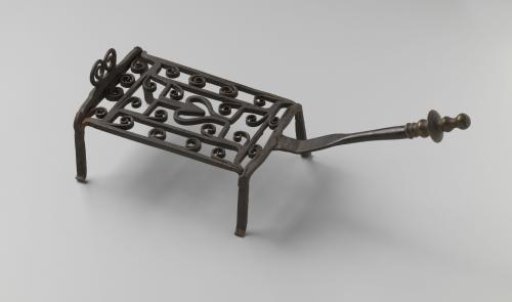 Iron grate with a copper knob